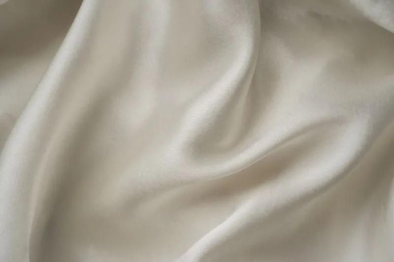 When Silk Meets Scale: How Mass Production Quietly Destroys What Makes Luxury Fabric Extraordinary
